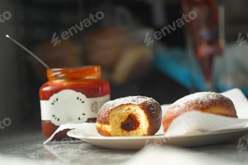 Preview: Plate of freshly made donuts covered in sugar and awaiting consumption