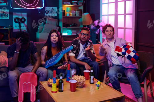 Preview: Diverse Group of Young Adults Watching Sports Game and Reacting Emotionally