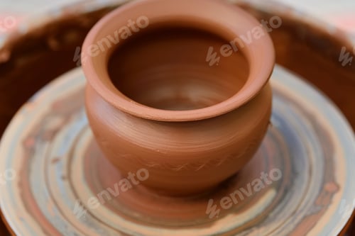 Preview: Potter making ceramic pot on the pottery wheel