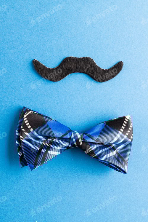 Preview: Bow Tie and Mustache on Blue Background
