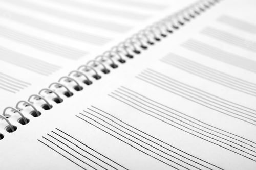 Preview: Notebook with empty staves for music notes as background, closeup