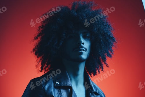Preview: Portrait of fashion man with curly hair on red background multinational, colored light, black
