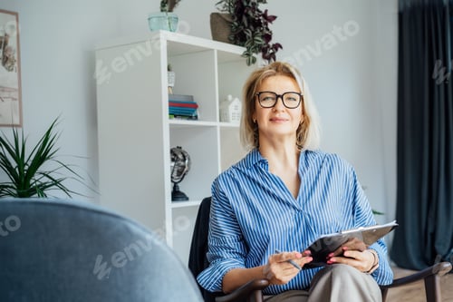 Preview: Professional Psychotherapy. Successful female Psychologist Smiling To Camera Sitting On armchair