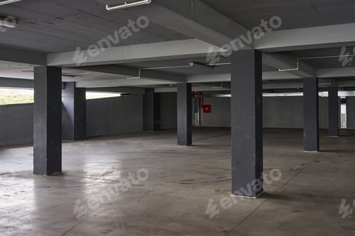 Preview: Empty underground parking lot or garage interior with concrete columns.
