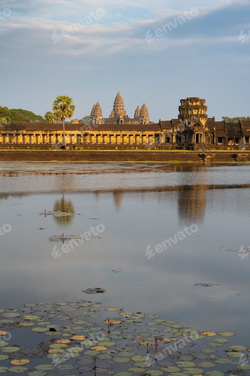 Preview: Beautiful, golden sunset casts warm light onto Angkor Wat, the ancient temple complex
in Cambodia