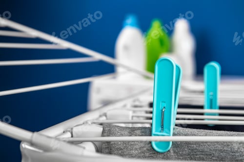 Preview: Clothes hanger rack dryer with clothespins close up
