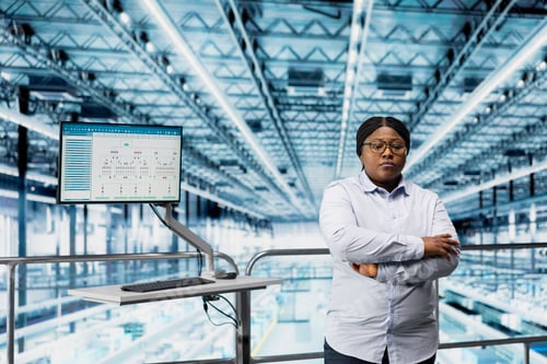 Preview: Woman in microchip smart factory using MES software