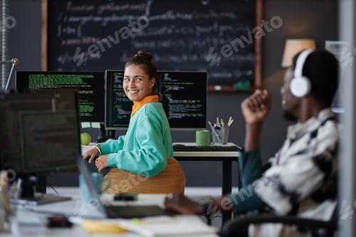Preview: Colleagues talking to each other in office