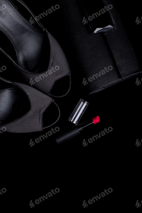 Preview: High Heels, Handbag, and Lipstick on Black Backdrop