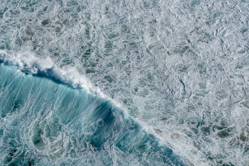 Preview: Top view of waves breaking at beach, aerial photography taken from helicopter
