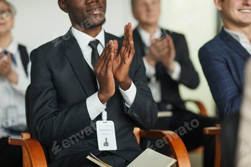 Preview: Businessman applauding at seminar