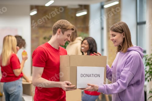 Preview: Volunteers working in a donations distribution center