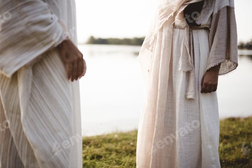 Preview: Closeup shot of two people wearing a biblical robe with a blurred background