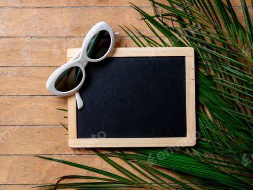 Preview: Sunglasses with blackboard and palm tree branch