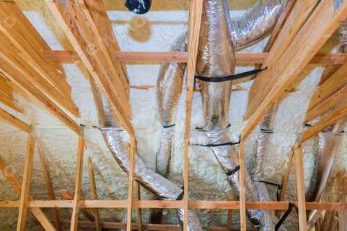 Preview: New home construction with selective focus of installation of heating system on the roof of the pipe