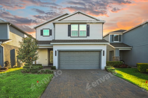 Preview: Exterior shot of a white two-story house with a garage at sunset in ST Cloud, US.