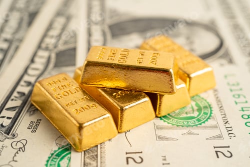 Preview: Gold bar on US dollar banknotes money, economy finance exchange trade investment concept.