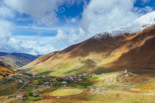 Preview: golden autumn landscape between the rocky mountains in Georgia. Malvnychi snow-capped peaks. Europe