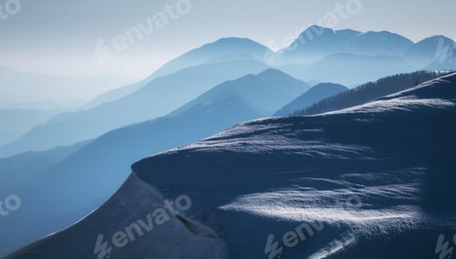 Preview: Mountain silhouettes in snowy conditions