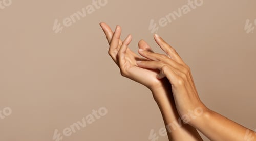 Preview: Hands of caucasian senior woman enjoy skin care, isolated on beige studio background, close up
