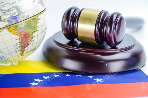 Preview: Venezuela flag and Judge hammer with globe world map.