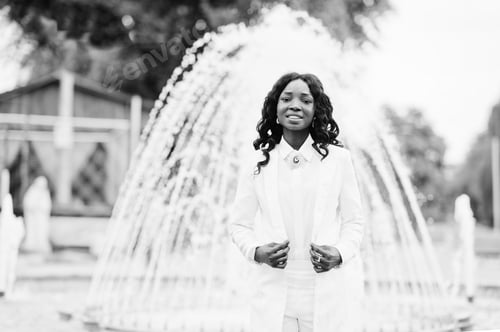 Preview: Stylish and beautiful black african american girl background fountain at city
