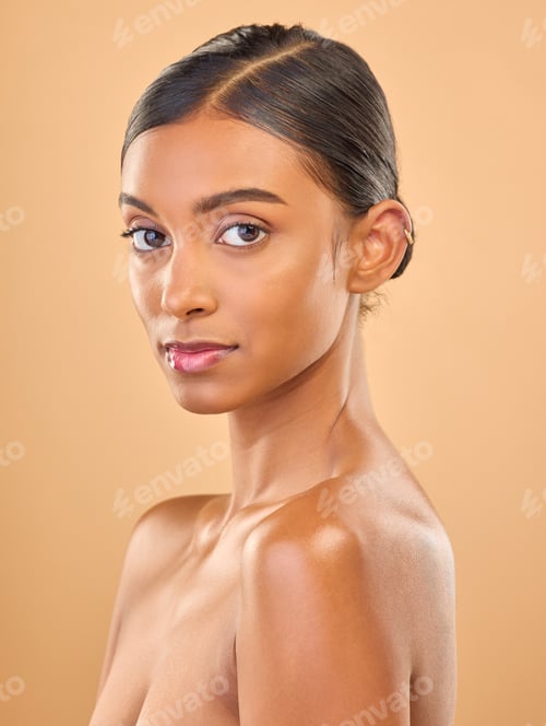 Preview: Face portrait, skincare and beauty of woman in studio isolated on brown background. Makeup, serious
