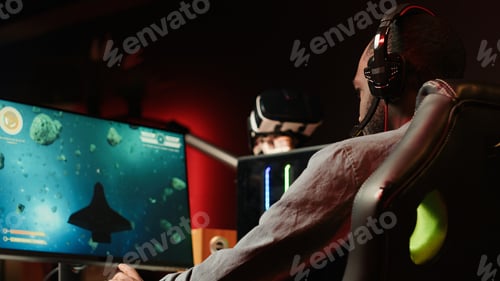 Preview: Close up of person enjoying galaxy flying game on computer monitor