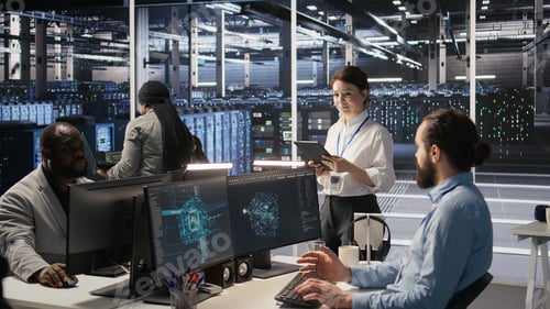 Preview: Data center team of technicians working on neural network software development