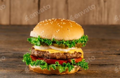 Preview: Home Made burgers with salad, bacon, cutlets on rustic wooden board burger with cutlet and tomatoes