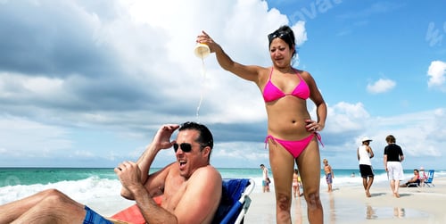 Preview: Generation X diversified couple at beach playing pranks in funniest photos with man all wet.