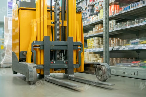 Preview: a forklift in the warehouse working and lifting the boxes of new income products