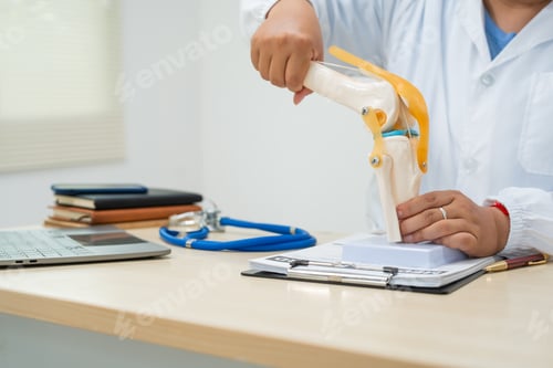 Preview: A female doctor works at desk in the hospital, discussing bone joint diseases like osteoarthritis,