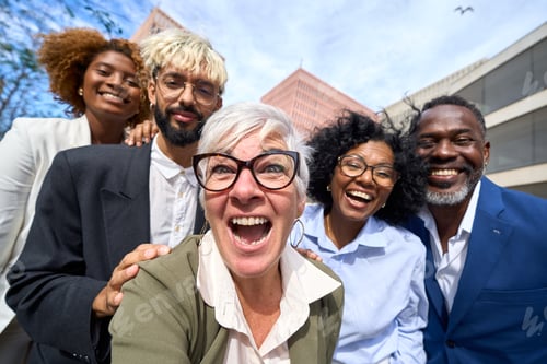 Preview: Happy business people taking a selfie together outdoors