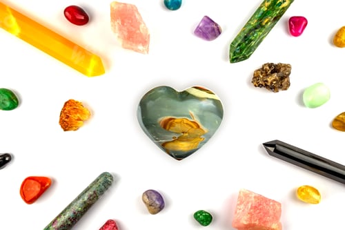 Preview: Natural gem geological crystals and stones on white background with Heart shaped one in the middle
