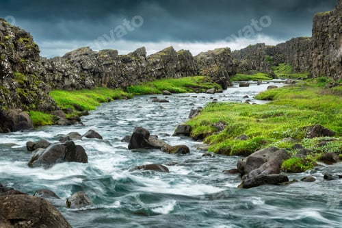 Preview: River flowing through rocky Icelandic landscape