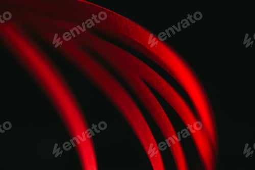 Preview: close up view of red quilling striped paper on black
