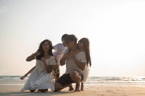 Preview: Asian Family walking at beach with kids happy vacation concept
