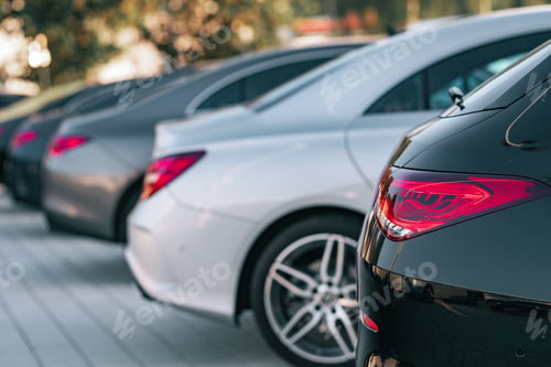 Preview: Selective focus view of different Mercedes-Benz cars parked in a row