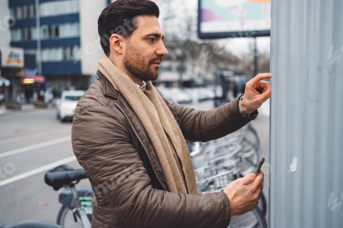 Preview: A business man prepares to drive his car around the city