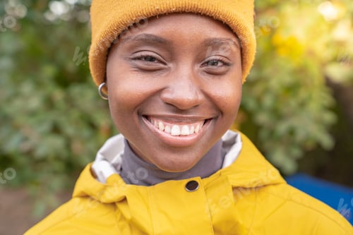 Preview: Portrait of african american woman smiling at nature - Pleased black girl in love with life