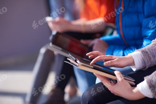 Preview: Students Group Working On School Project Together On Tablet Computer At Modern University