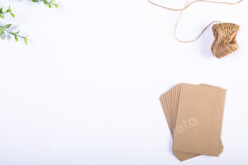 Preview: Composition of envelopes, string, branches and copy space on white background
