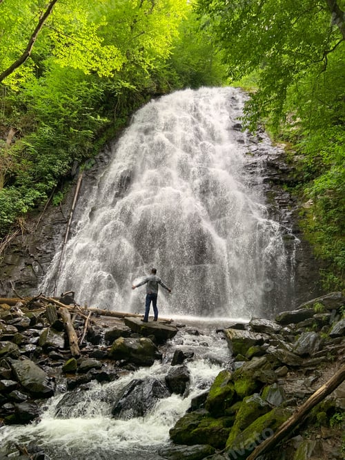 Preview: Man enjoying the waterfall