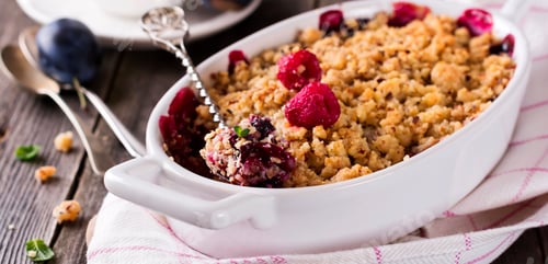 Preview: Plum and raspberry crumb on the old wooden background. Rustic style. Selective focus.