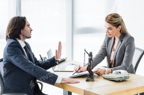 Preview: businessman looking at lawyer with contract and showing stop sign in office