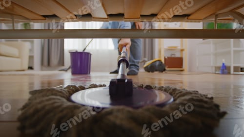 Preview: Mopping under sofa