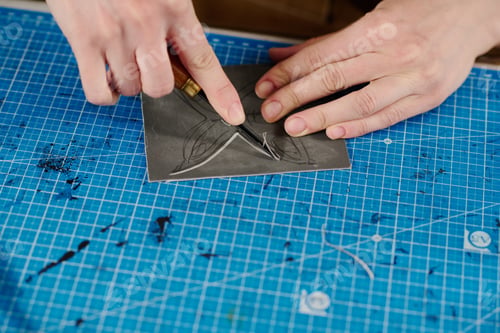 Preview: Woman cutting out butterfly pattern