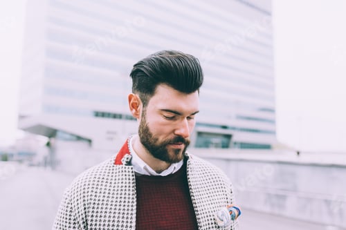 Preview: Portrait young confident bearded business man outdoor