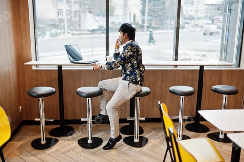 Preview: Indian man at fast food cafe